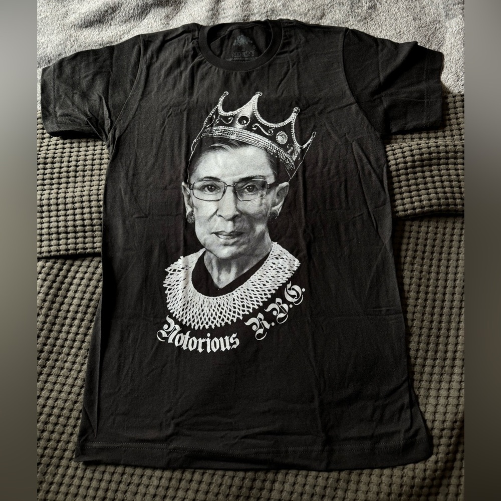 New, never worn black women’s tshirt. “Notorious RBG” print. Size small.